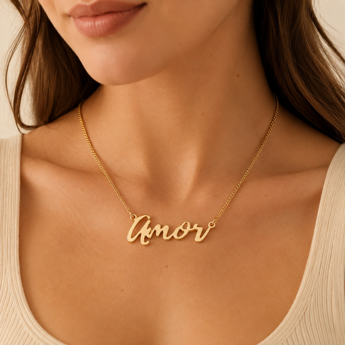 "Amor" Necklace detail photo - alternate angle of polished gold script lettering Anthology Jewelry