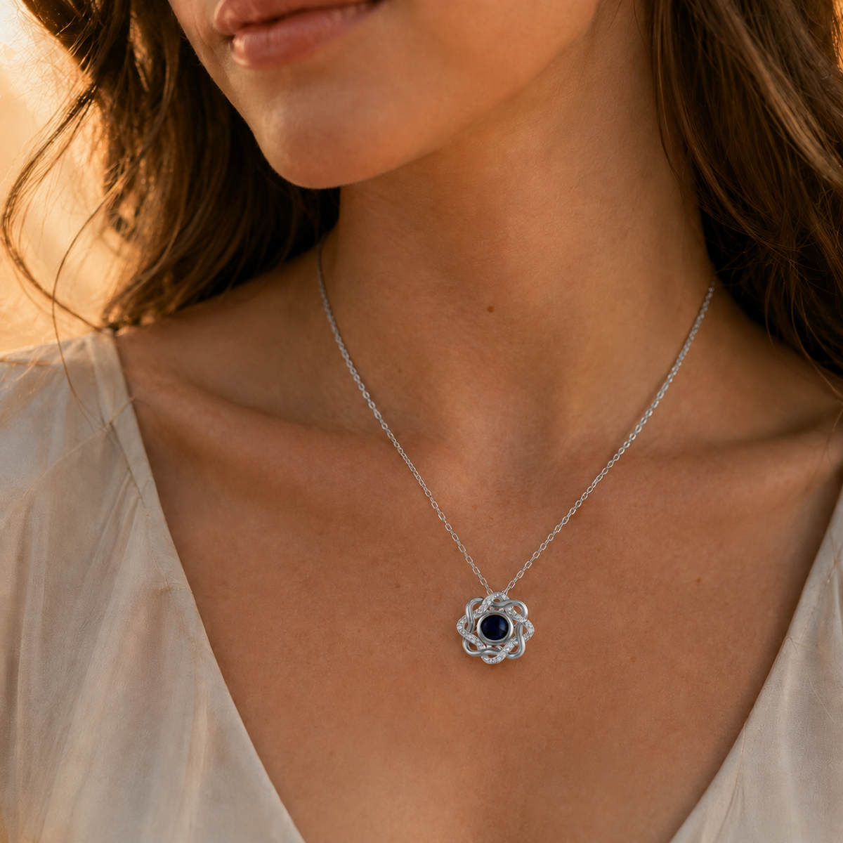 Silver open heart crystal photo projection necklace lifestyle sunset - Anthology Jewelry