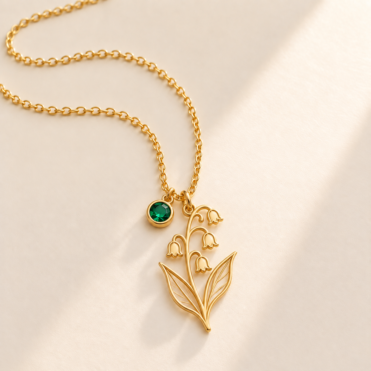 Custom Birth Flower & Birthstone Necklace hero photo - Gold May lily of the valley birth flower charm with Emerald birthstone Anthology Jewelry