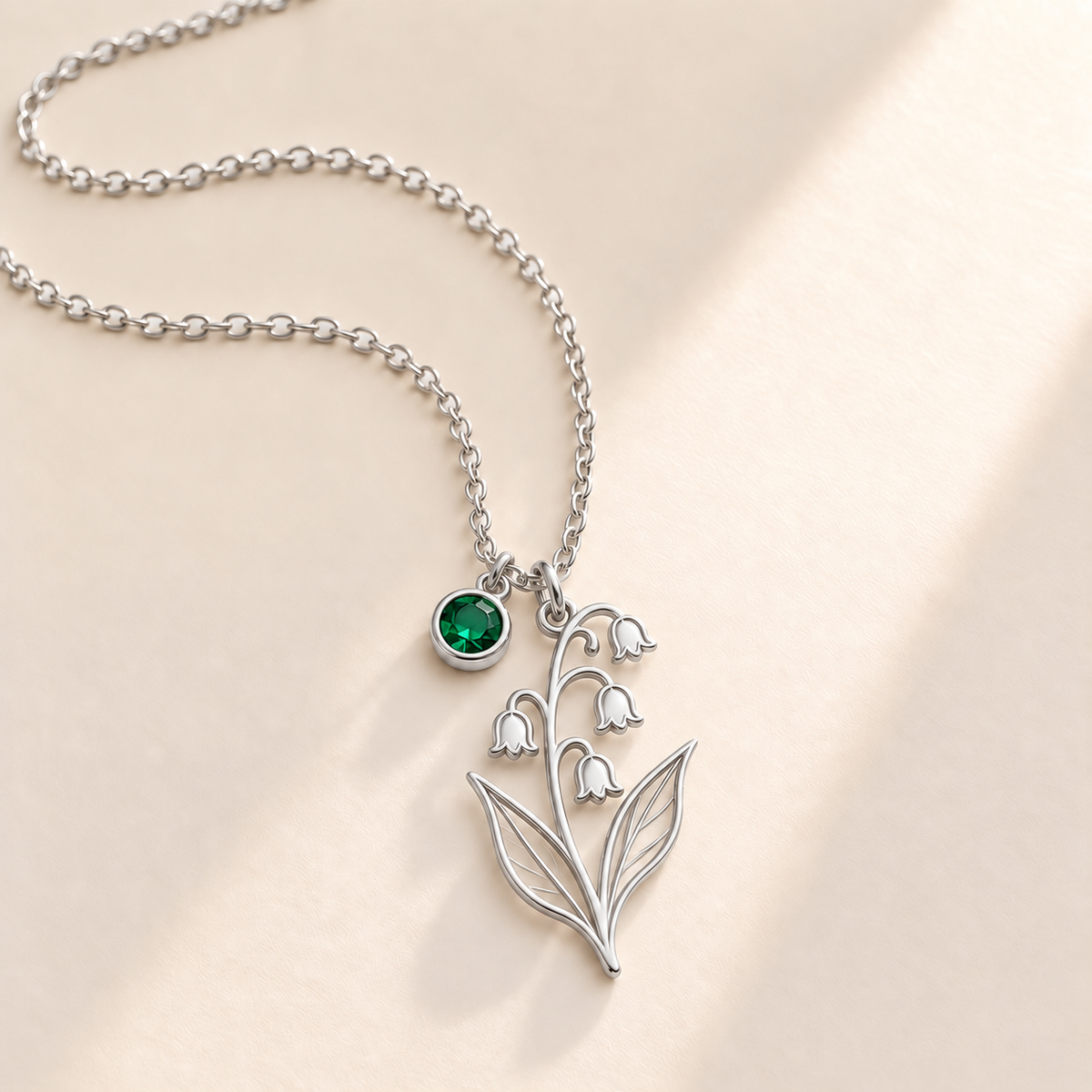 Custom Birth Flower & Birthstone Necklace hero photo - Silver May lily of the valley birth flower charm with Emerald birthstone Anthology Jewelry