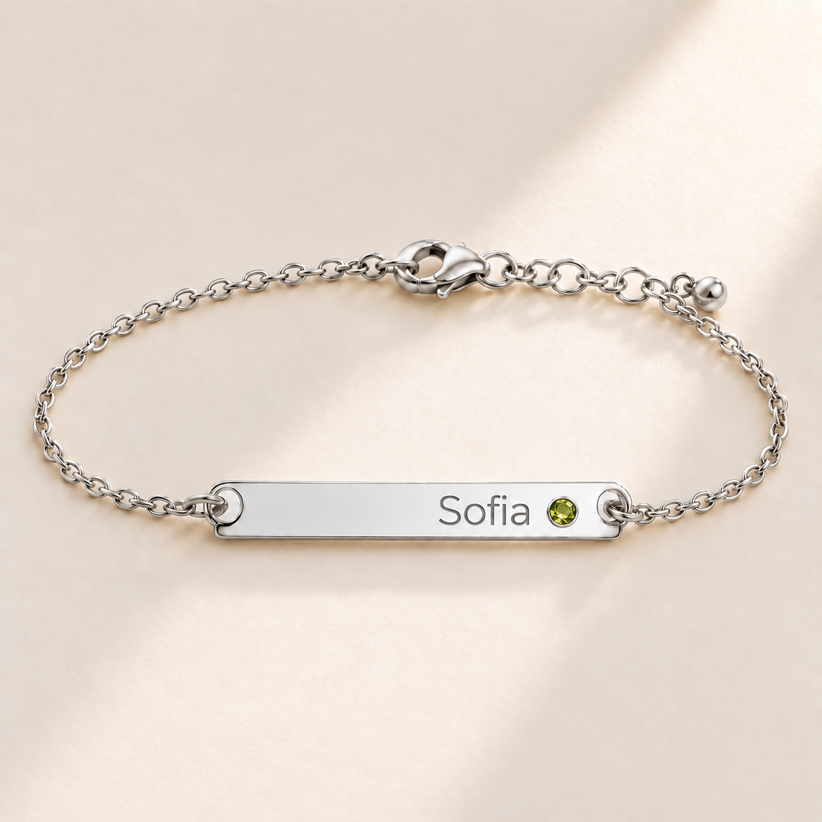 Birthstone Bar Bracelet hero photo - silver august peridot with Sofia engraving in Montserrat Anthology Jewelry