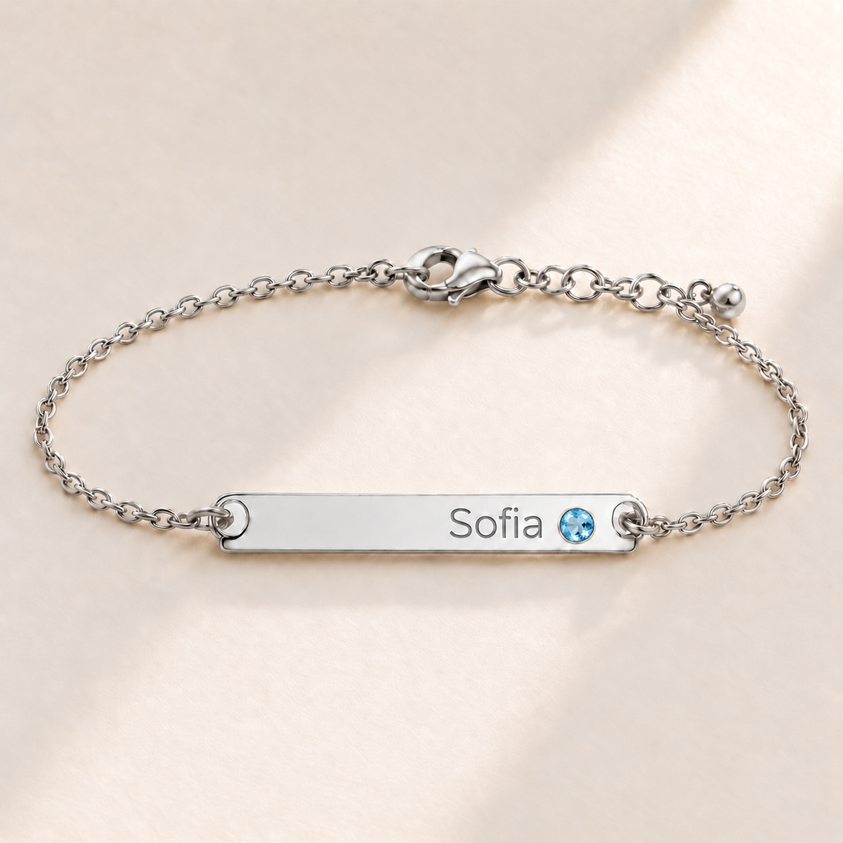 Birthstone Bar Bracelet hero photo - silver december blue topaz with Sofia engraving in Montserrat Anthology Jewelry