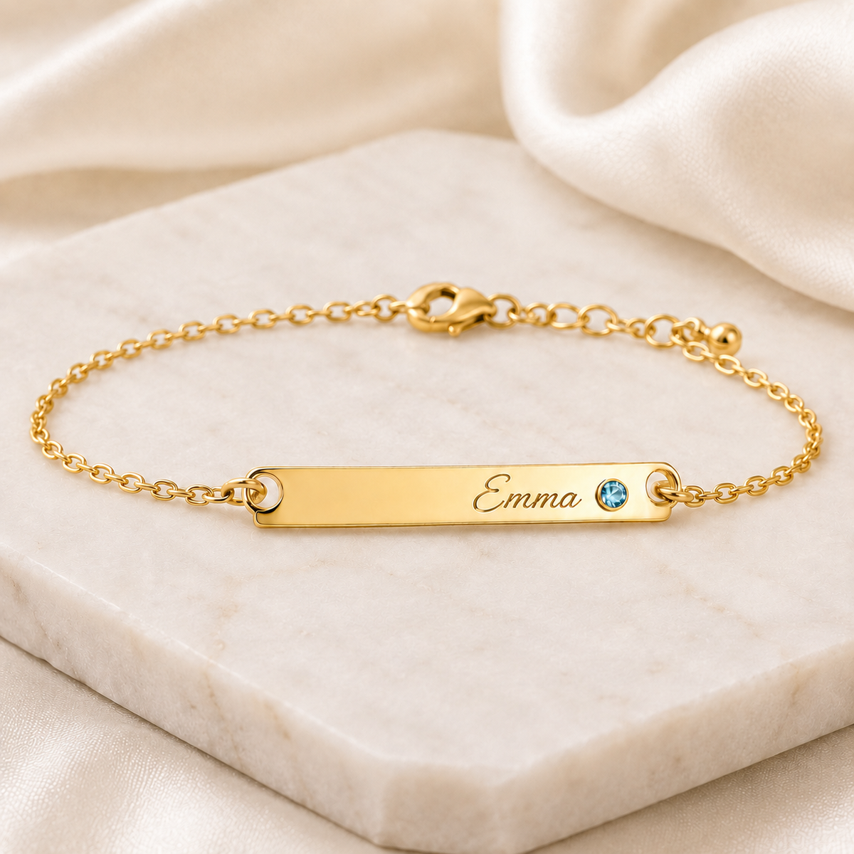 Birthstone Bar Bracelet glamour photo - gold Emma engraving and smaller round pale blue March gemstone Anthology Jewelry