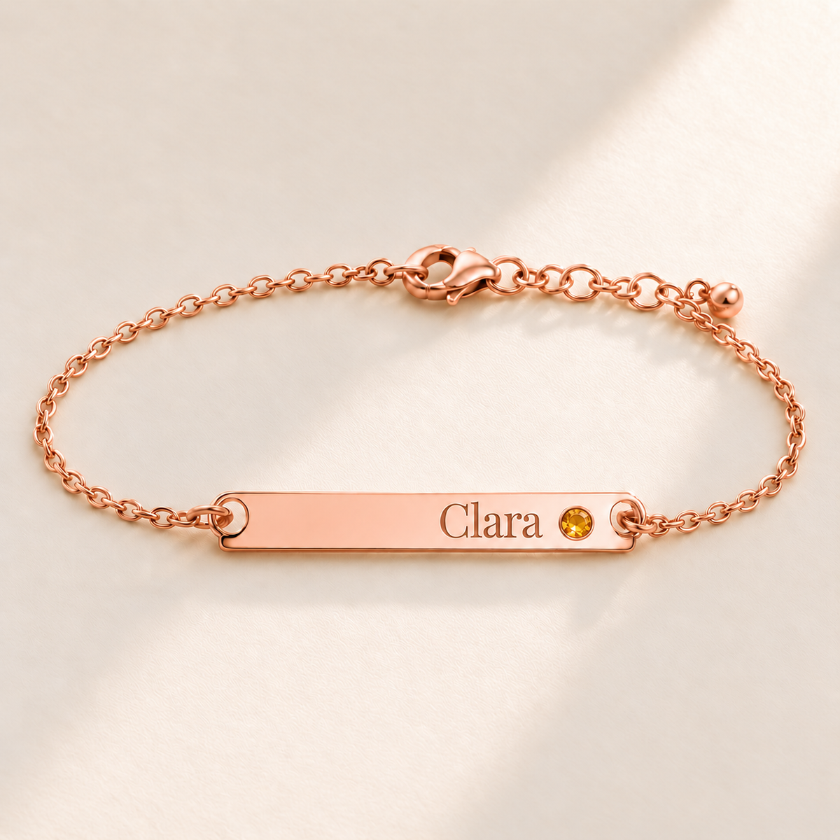 Birthstone Bar Bracelet hero photo - rose gold november citrine with Clara engraving in Playfair Display Anthology Jewelry