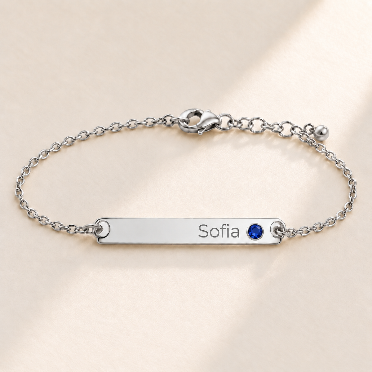 Birthstone Bar Bracelet hero photo - silver september sapphire with Sofia engraving in Montserrat Anthology Jewelry
