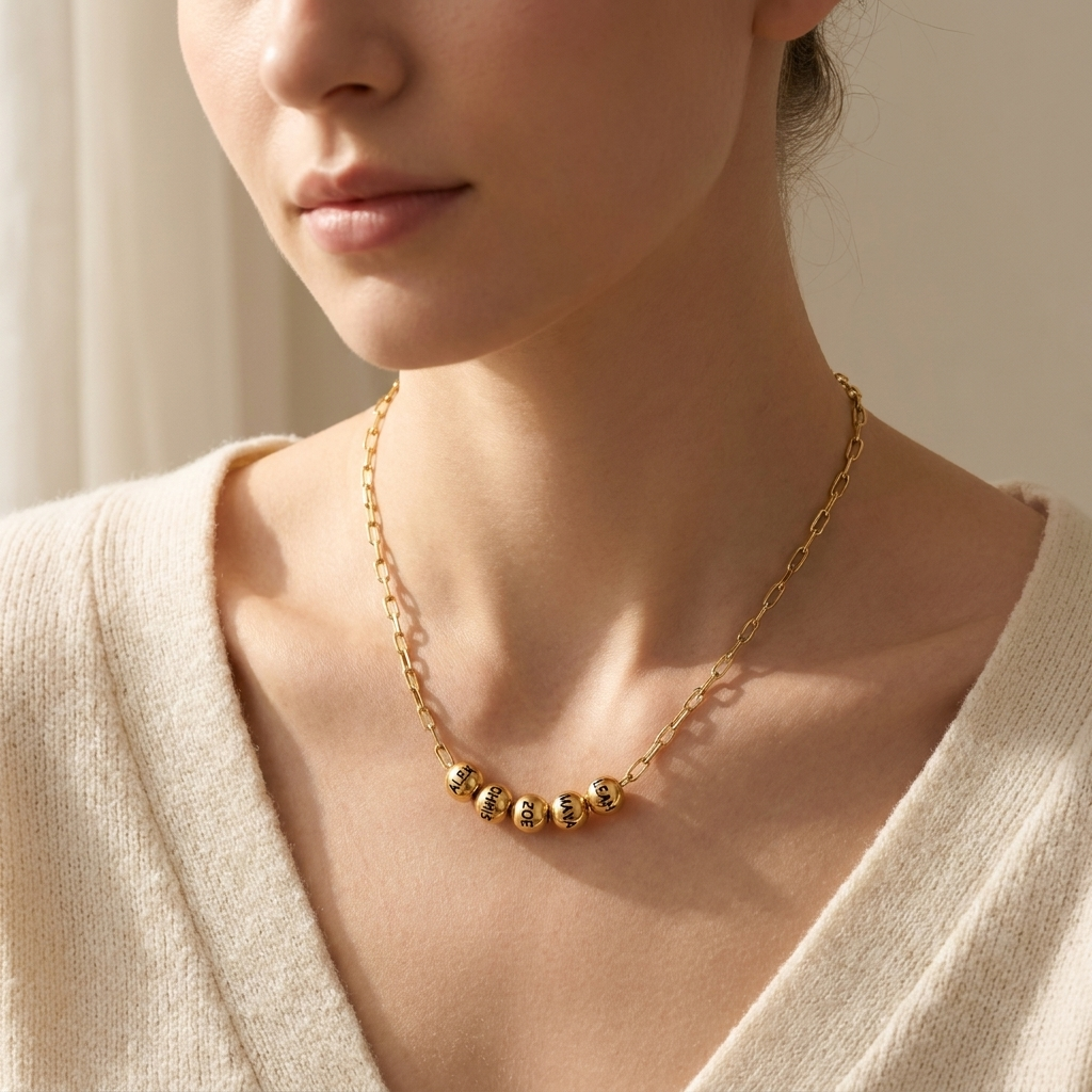Custom Add-A-Bead Necklace lifestyle photo - woman wearing gold name bead necklace at the collarbone Anthology Jewelry