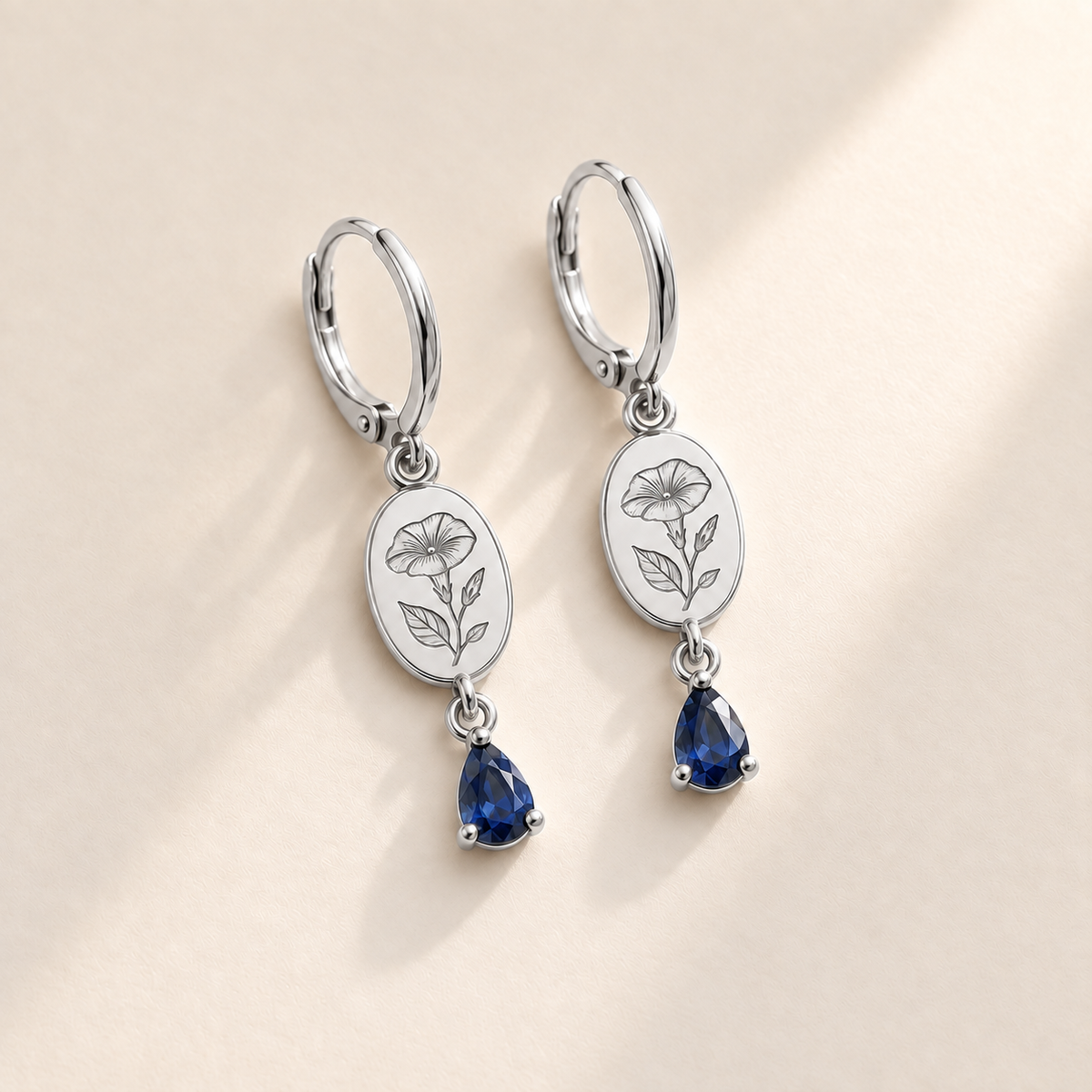 Custom Birth Flower & Birthstone Drop Earrings hero photo - silver morning glory and sapphire earrings Anthology Jewelry
