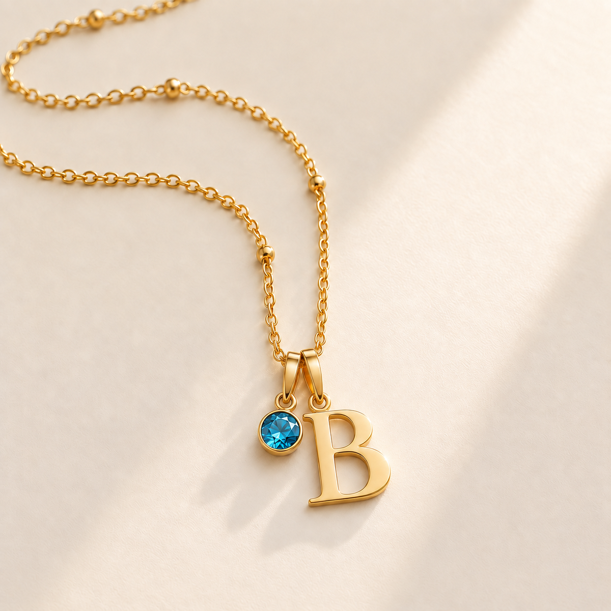 Custom Birthstone Initial Necklace stone december photo - two separate bails with serif initial B and round birthstone Anthology Jewelry