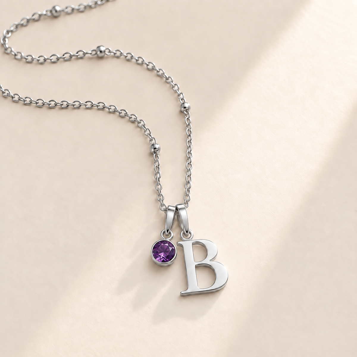 Custom Birthstone Initial Necklace silver February birthstone photo - serif initial B with round purple stone Anthology Jewelry