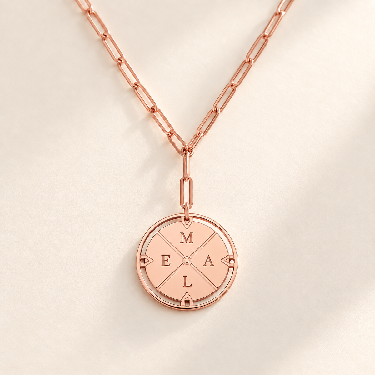 Custom Compass Initial Necklace rose gold compass pendant on pale ivory background Anthology Jewelry