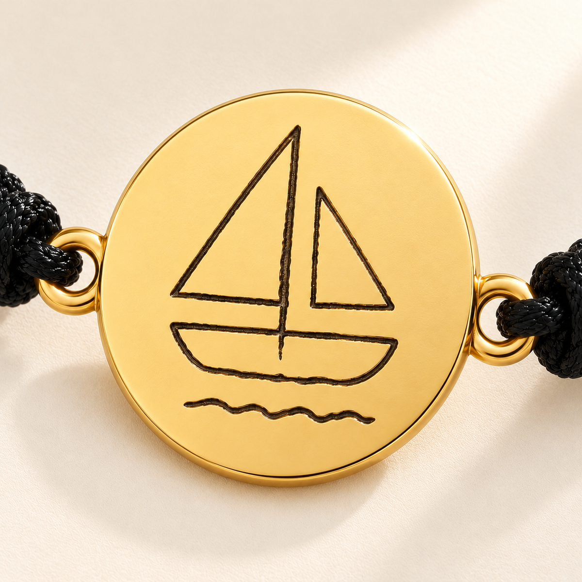 Custom Drawing Bracelet | Men's Black Braided Cord macro detail photo - complete sailboat disc in gold, design concept Anthology Jewelry