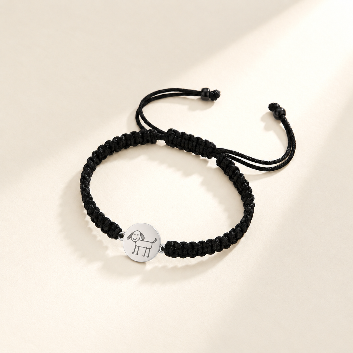 Custom Drawing Bracelet | Men's Black Braided Cord hero-silver photo - silver hand-drawn dog engraving, generated design concept Anthology Jewelry