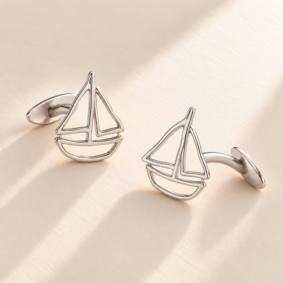 Custom Drawing Cufflinks hero photo - silver open hand-drawn sailboat matching pair with fixed rear plates, generated design concept Anthology Jewelry
