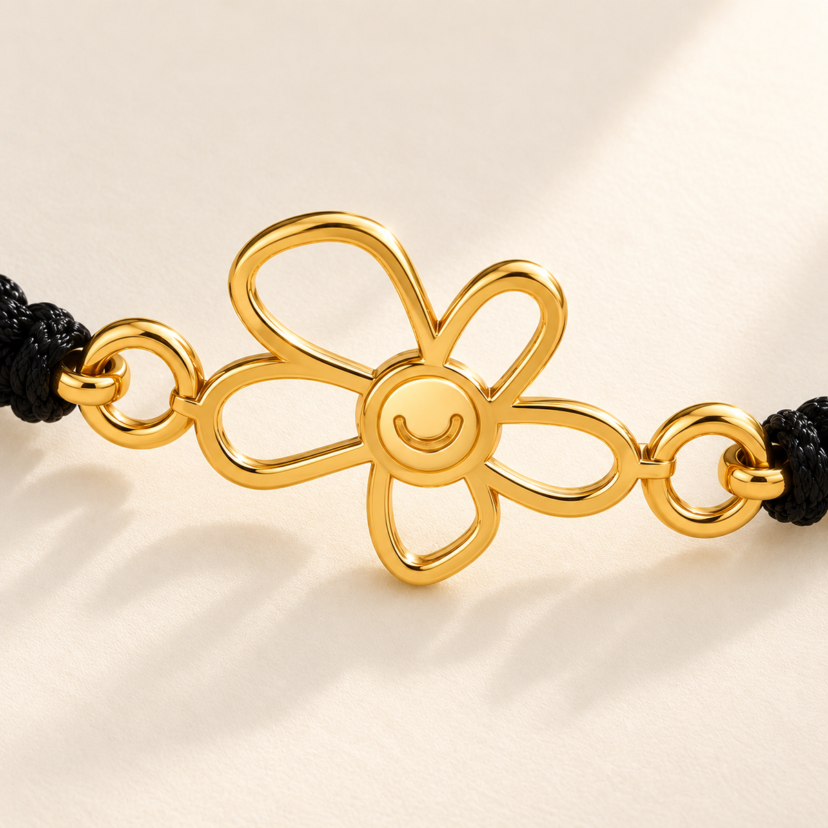 Custom Drawing Cutout Bracelet | Men's Black Braided Cord detail photo - close-up of the complete gold open flower and both side connector rings, design concept Anthology Jewelry