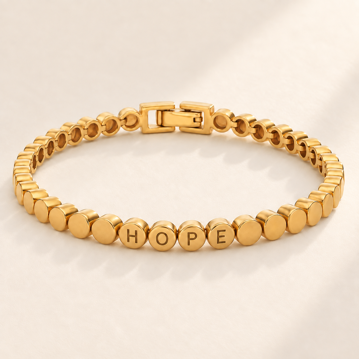 Custom Engraved Dot Bracelet hero photo - HOPE across four linked round gold beads Anthology Jewelry