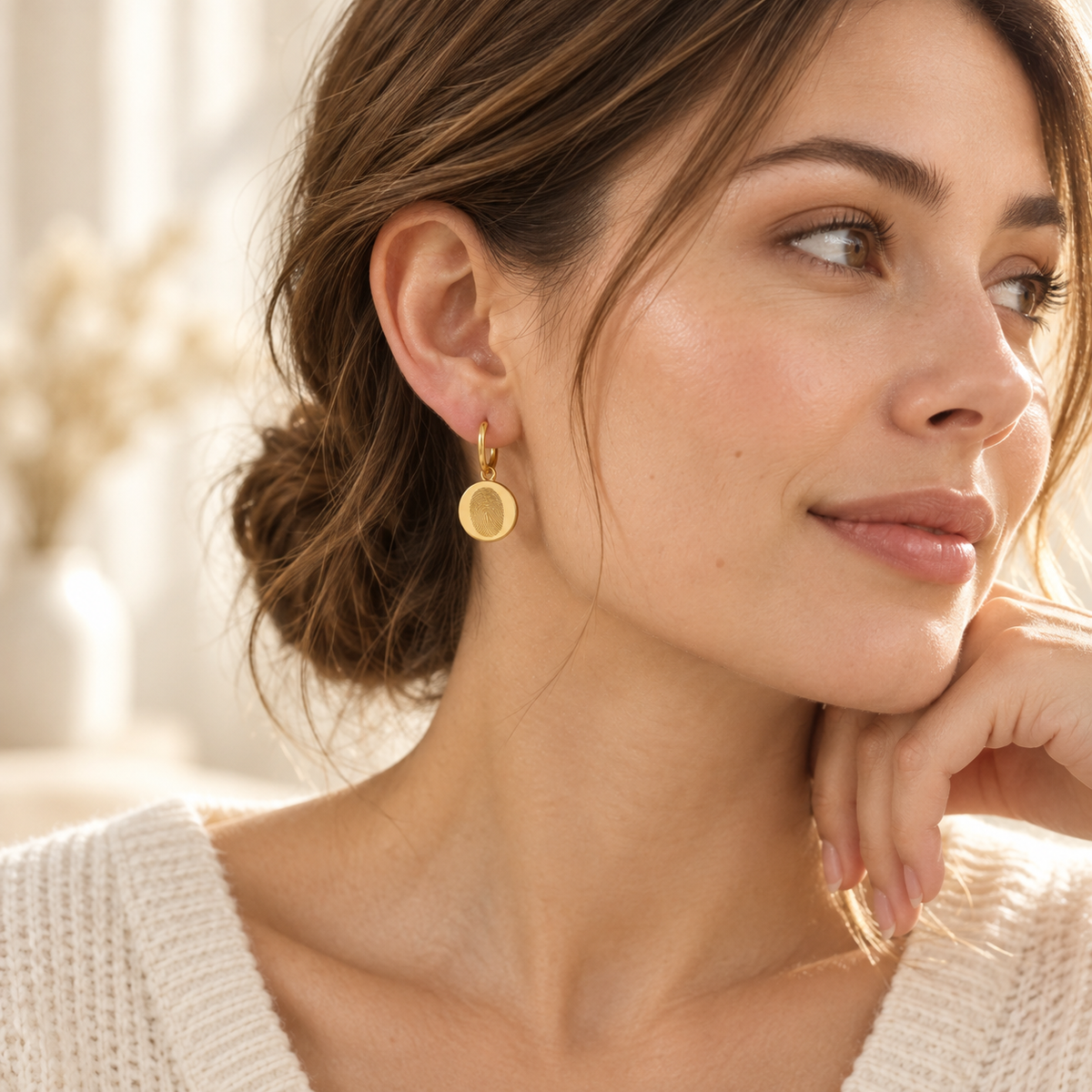 Custom Fingerprint Huggie Hoop Earrings lifestyle photo - three-quarter portrait wearing gold fingerprint earring Anthology Jewelry