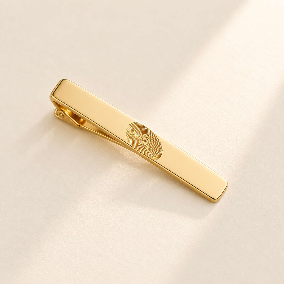 Custom Fingerprint Tie Clip hero photo - gold tie clip with fingerprint engraving Anthology Jewelry