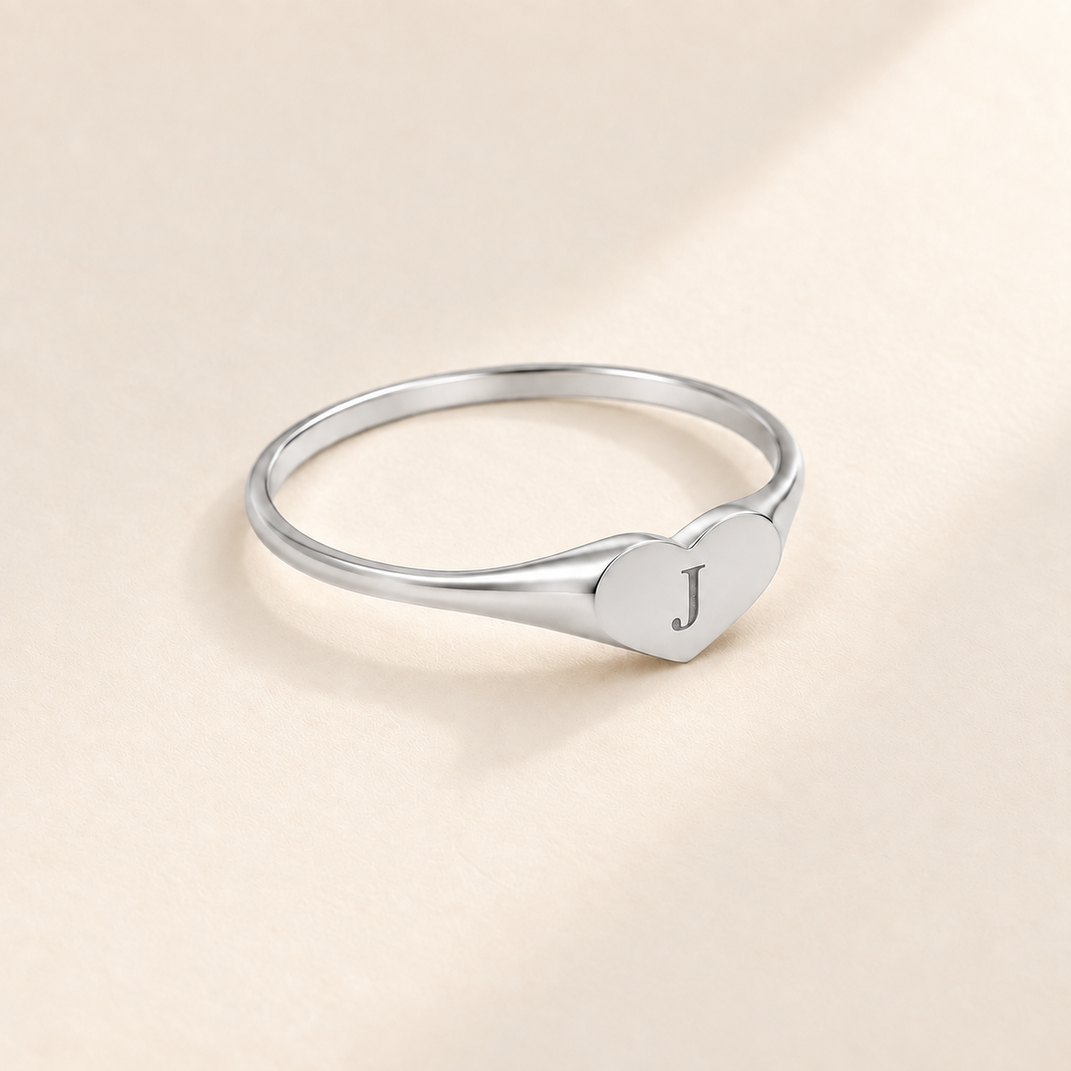 Custom Heart Signet Initial Ring hero photo - silver heart signet ring with an engraved initial Anthology Jewelry