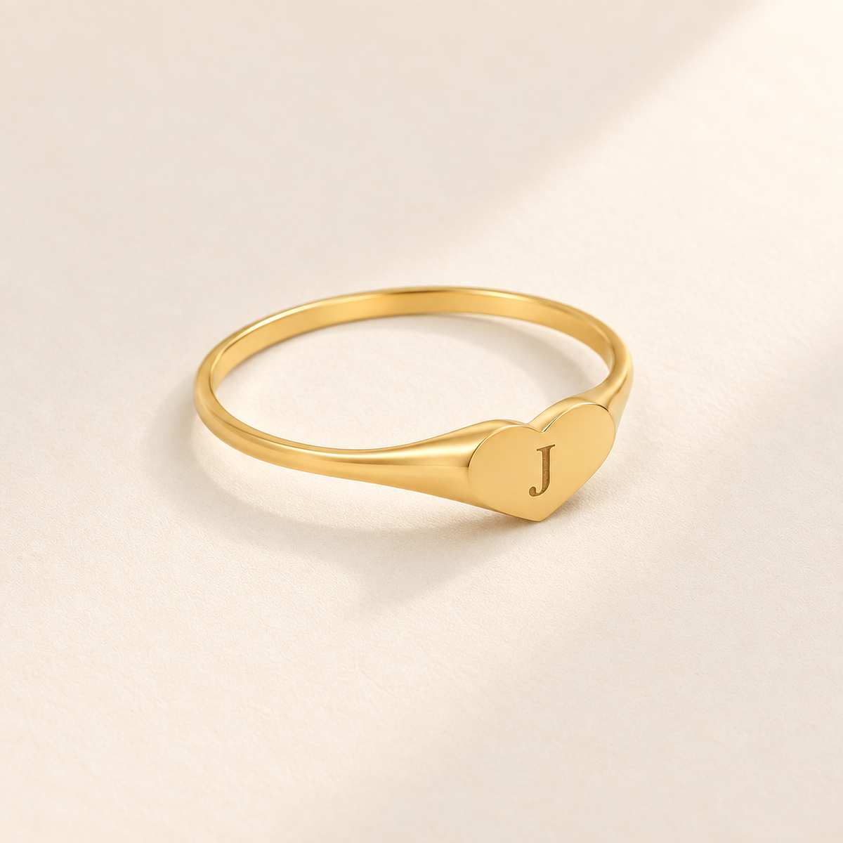 Custom Heart Signet Initial Ring hero photo - gold heart signet with engraved J Anthology Jewelry
