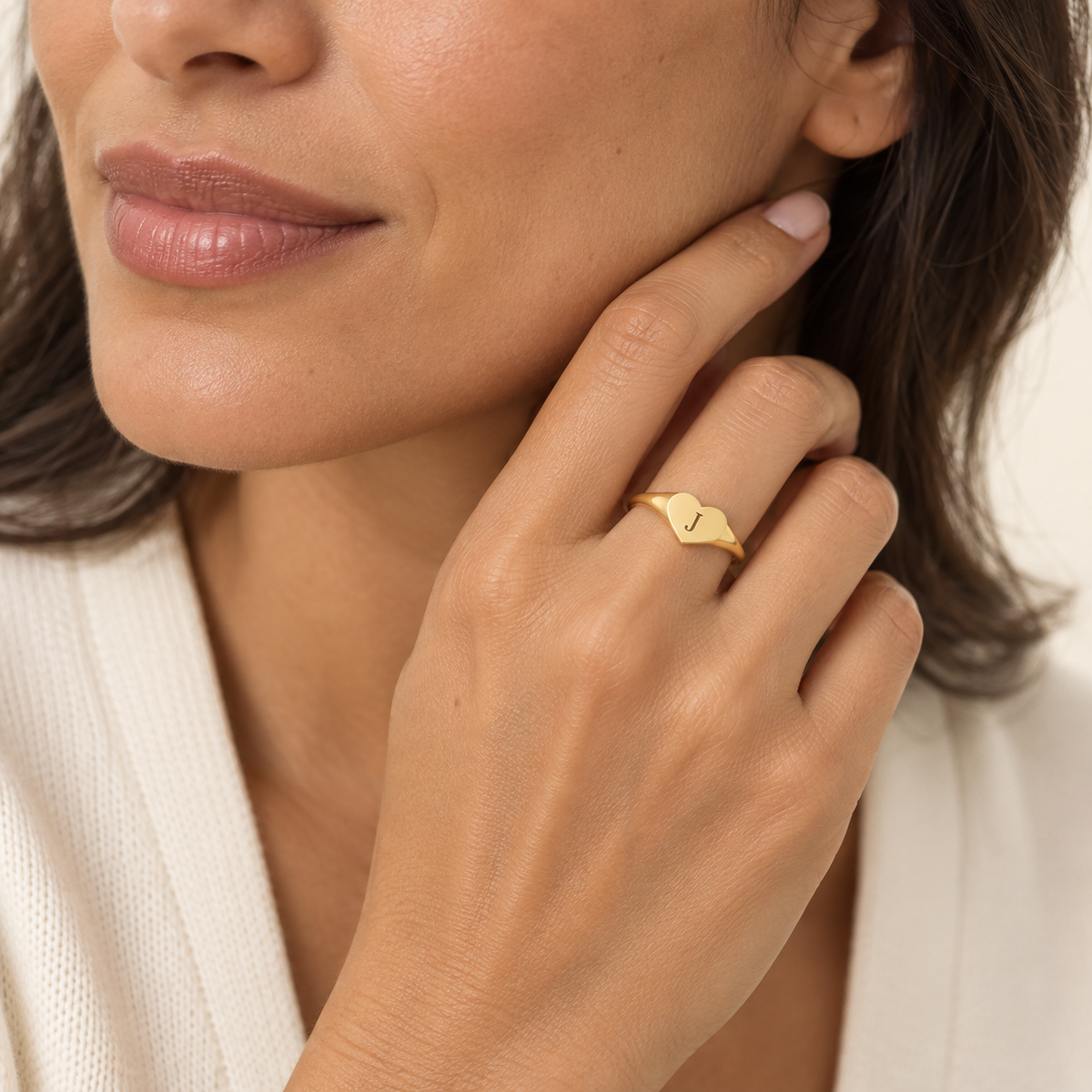 Custom Heart Signet Initial Ring lifestyle photo - gold heart signet ring with engraved initial worn on the hand Anthology Jewelry
