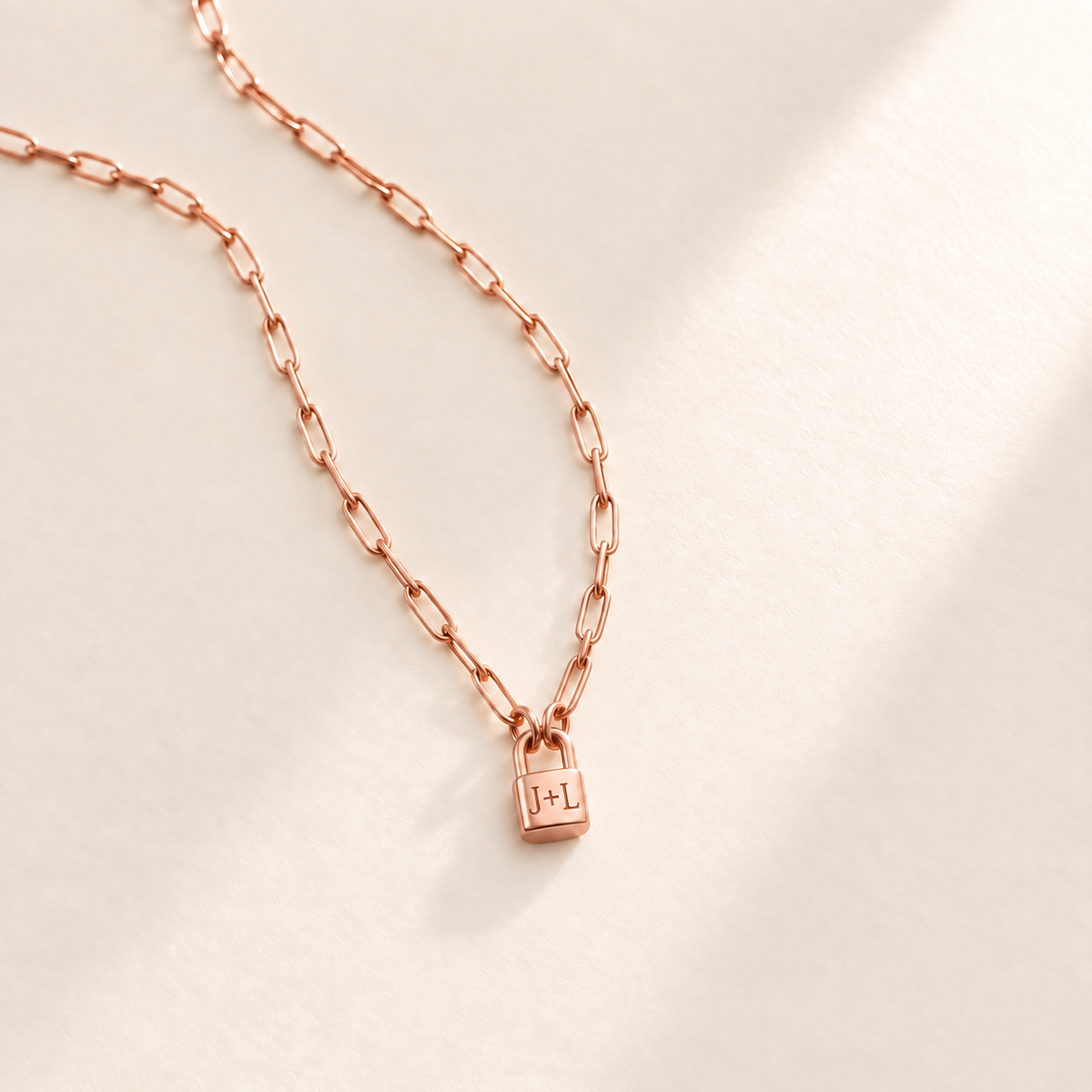 Custom Initial Lock Necklace hero rose gold photo - tiny closed padlock on paperclip chain Anthology Jewelry