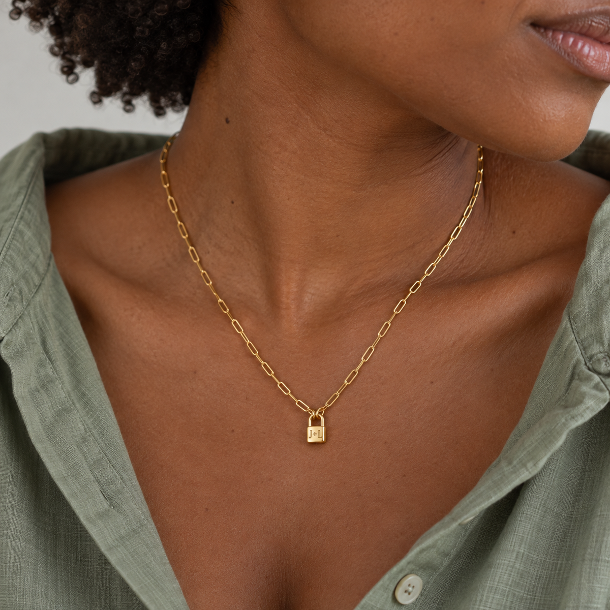 Custom Initial Lock Necklace lifestyle 1 photo - tiny closed padlock on paperclip chain Anthology Jewelry