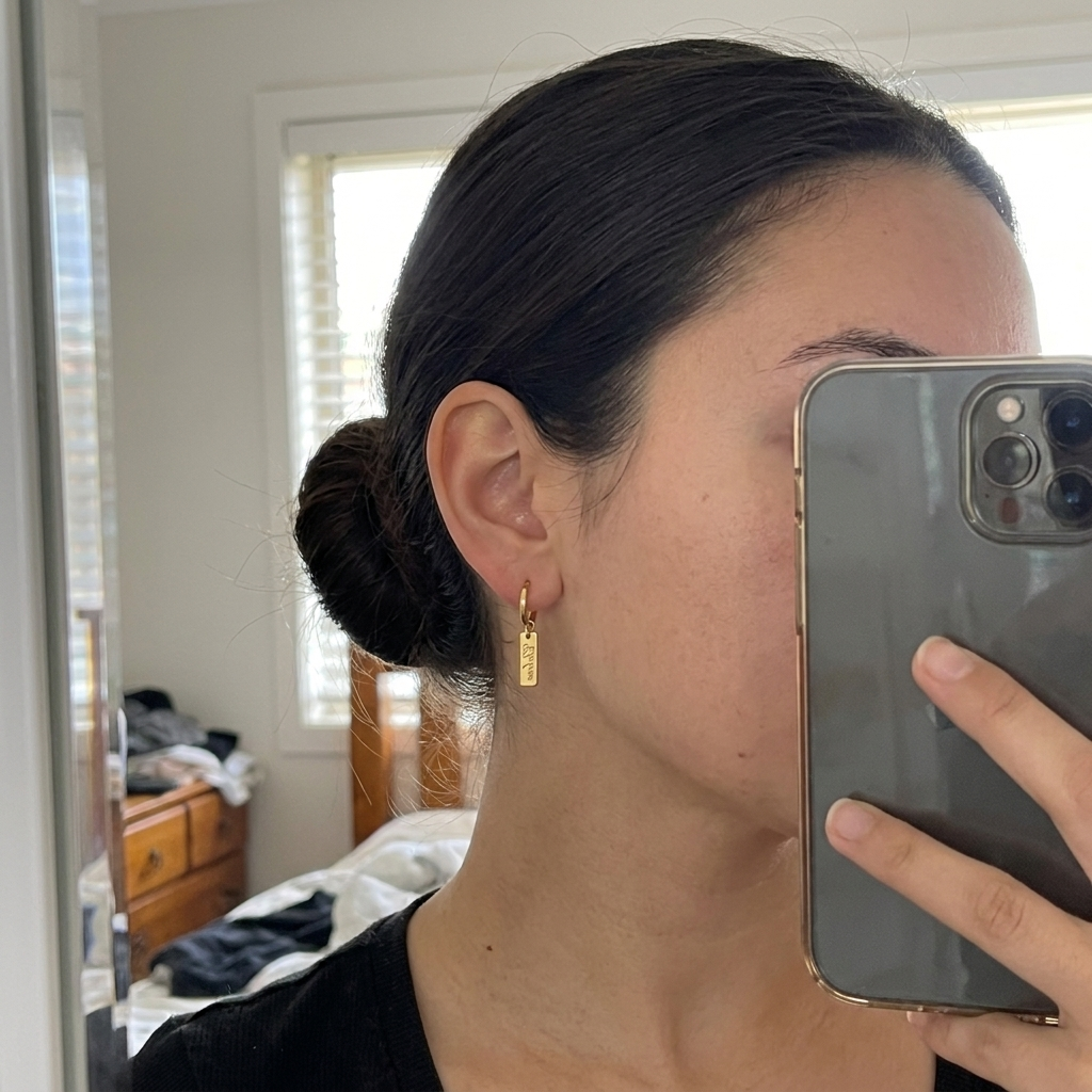 Custom Nameplate Huggie Hoop Earrings UGC photo - candid mirror selfie wearing gold huggie hoop earrings Anthology Jewelry