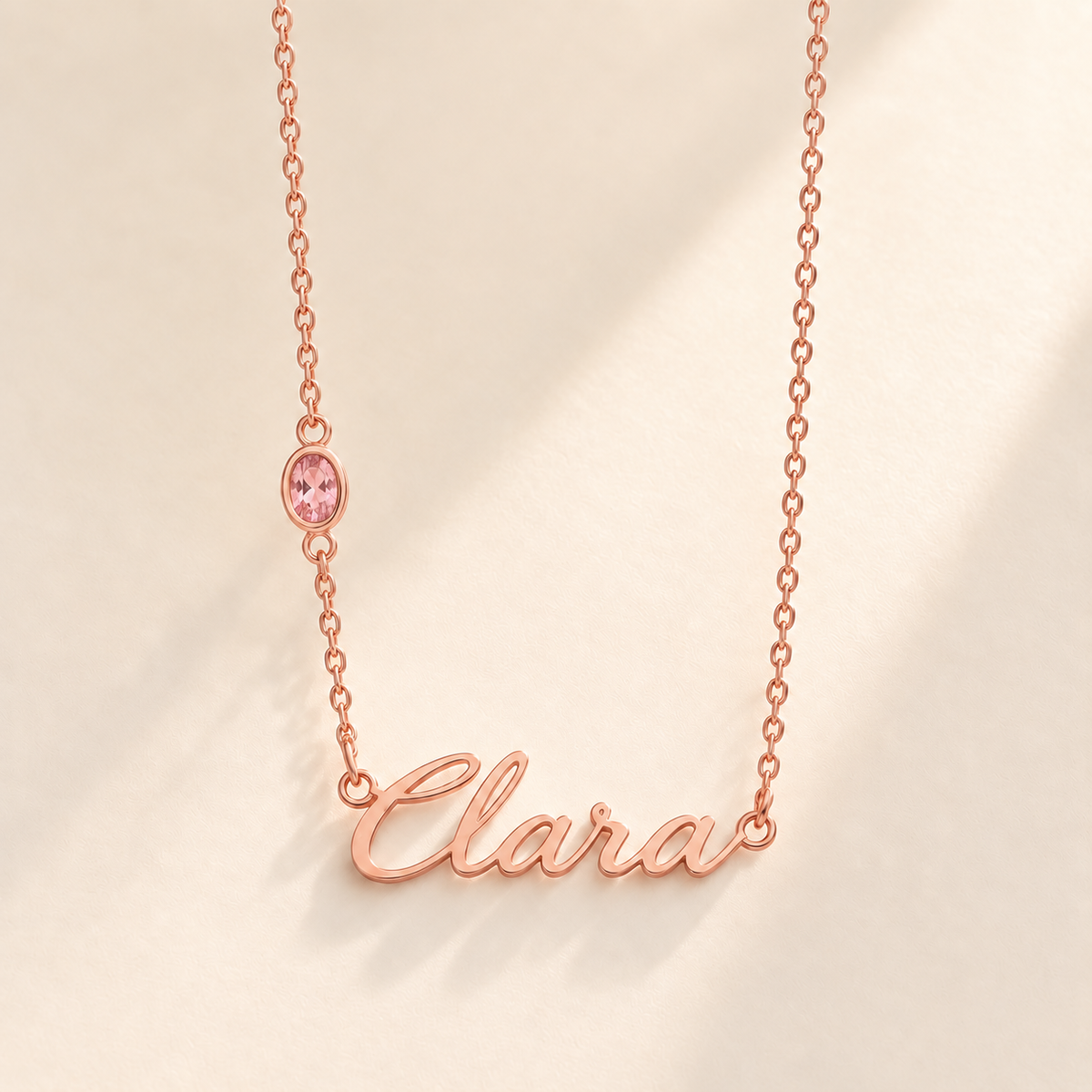 Rose gold script Clara necklace with pink stone on left chain