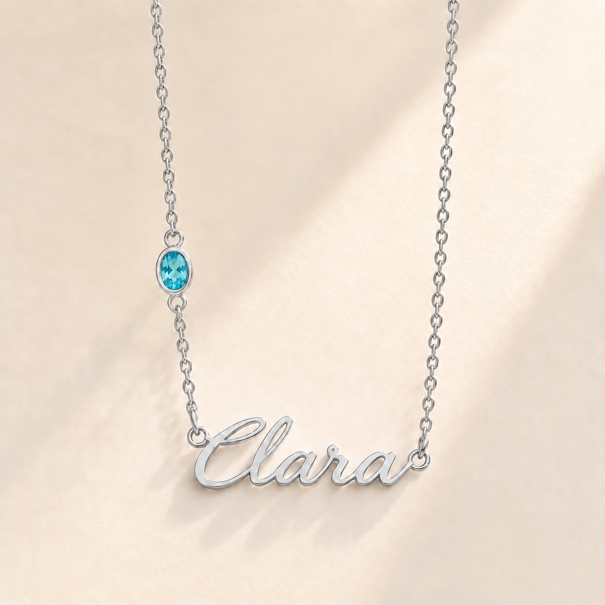 Custom Offset Birthstone Script Name Necklace december silver birthstone photo - Clara script with oval left-chain stone Anthology Jewelry