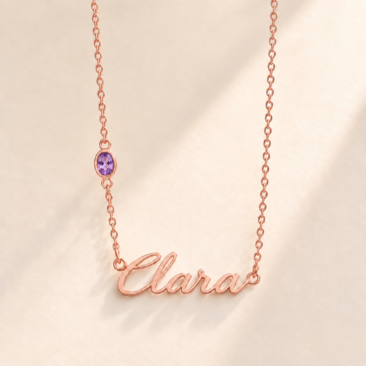 Custom Offset Birthstone Script Name Necklace february rose gold birthstone photo - Clara script with oval left-chain stone Anthology Jewelry