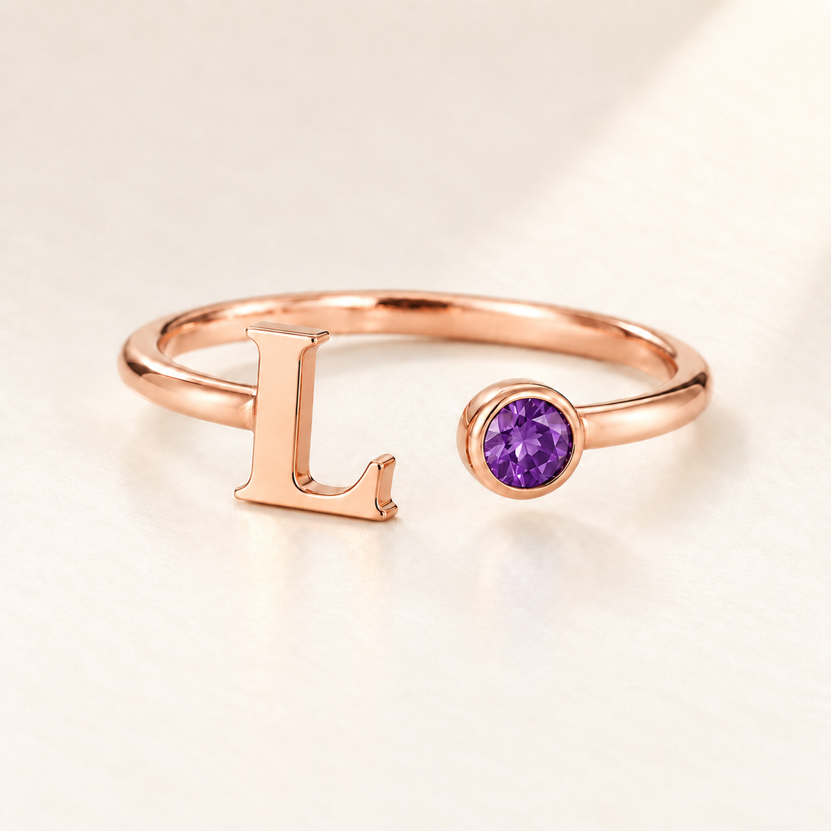 Custom Open Birthstone Initial Ring, rose gold february birthstone variant image; ivory background