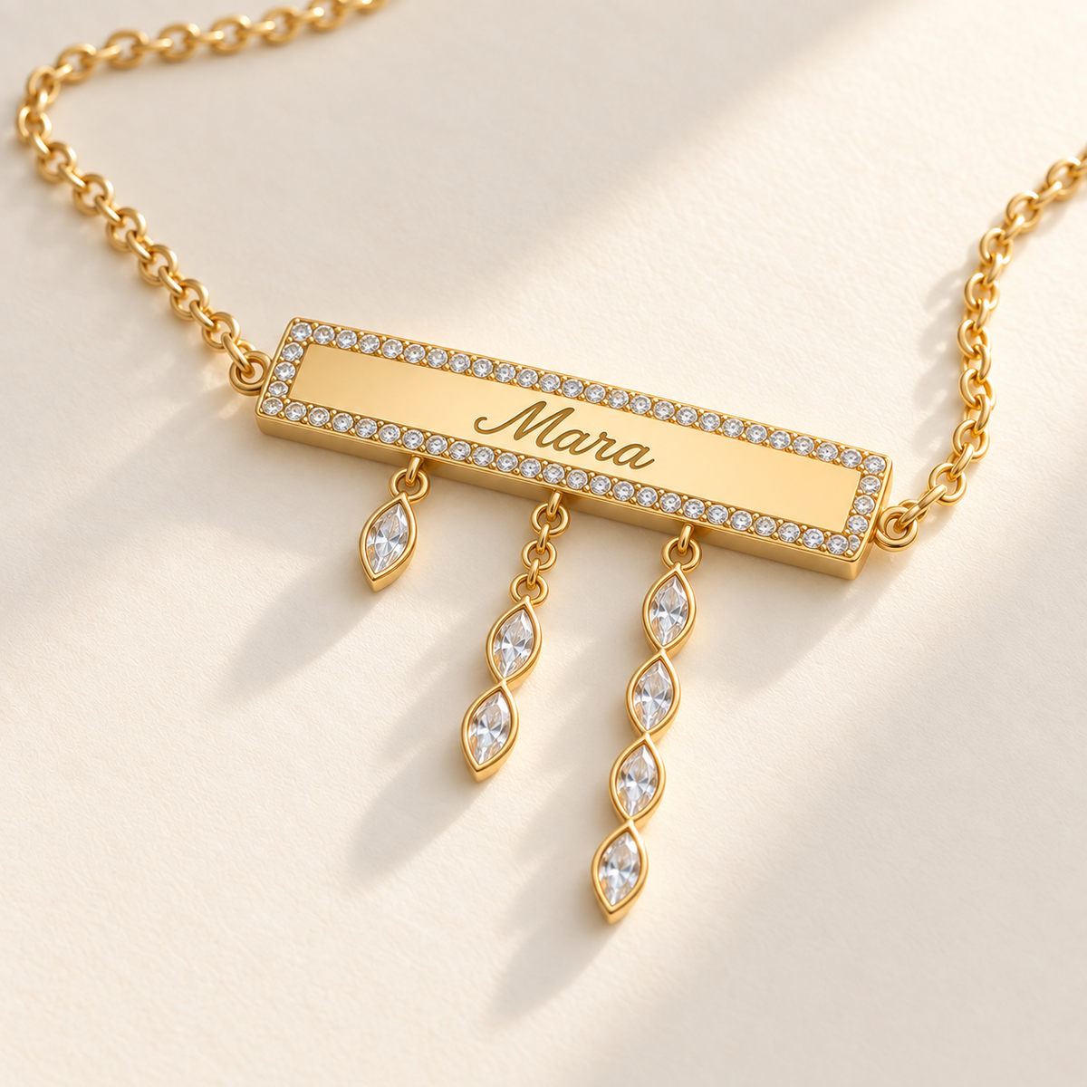 Custom Pavé Nameplate Drop Necklace macro detail of engraved Mara bar and 1, 2 and 4 marquise drops photo - Anthology Jewelry
