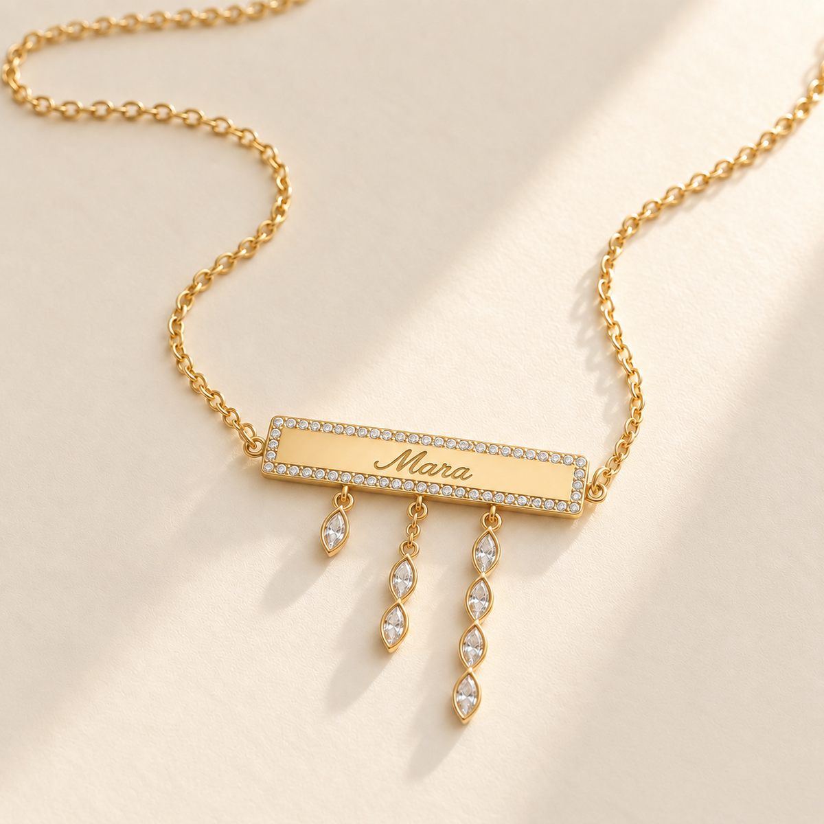 Custom Pavé Nameplate Drop Necklace gold hero, pavé name bar and three marquise drop strands photo - Anthology Jewelry