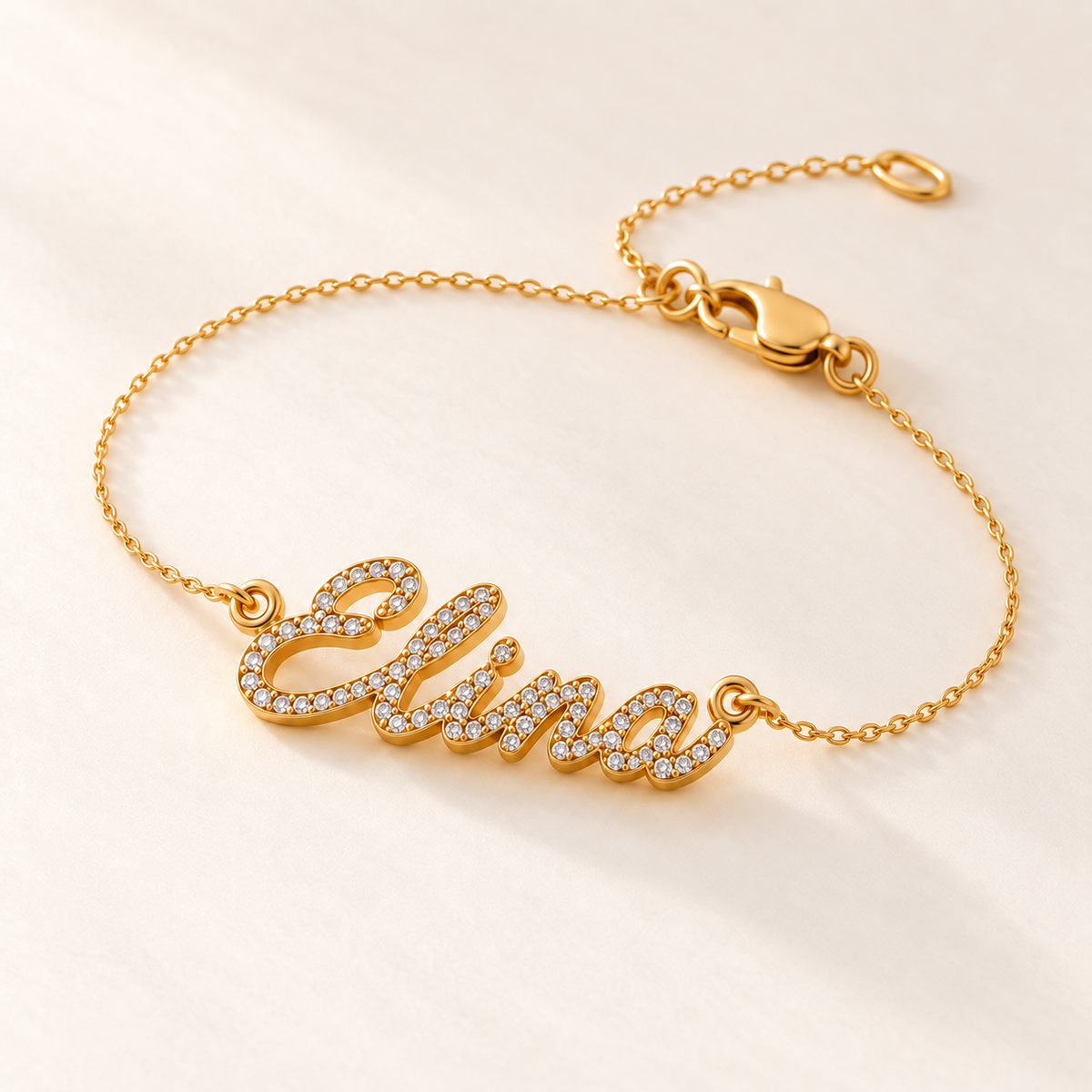 Three-quarter product-only view of Elina pavé script name bracelet