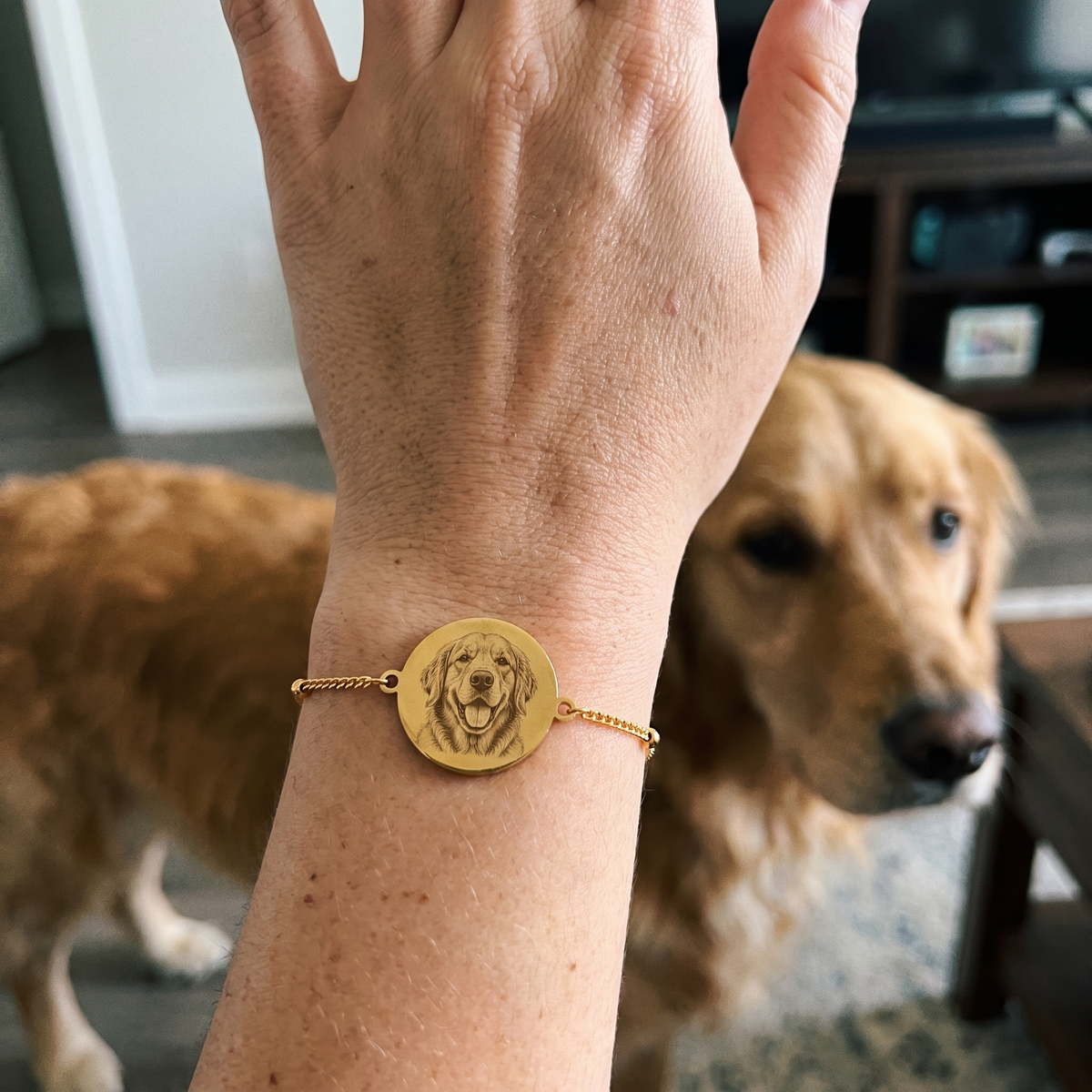 Custom Pet Portrait Bracelet UGC photo - gold golden retriever portrait bracelet worn on wrist with dogs in background Anthology Jewelry