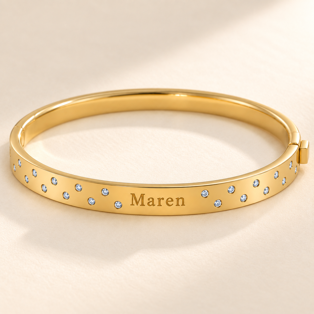 Close view of Maren engraving, small clear stones and right-side hinge