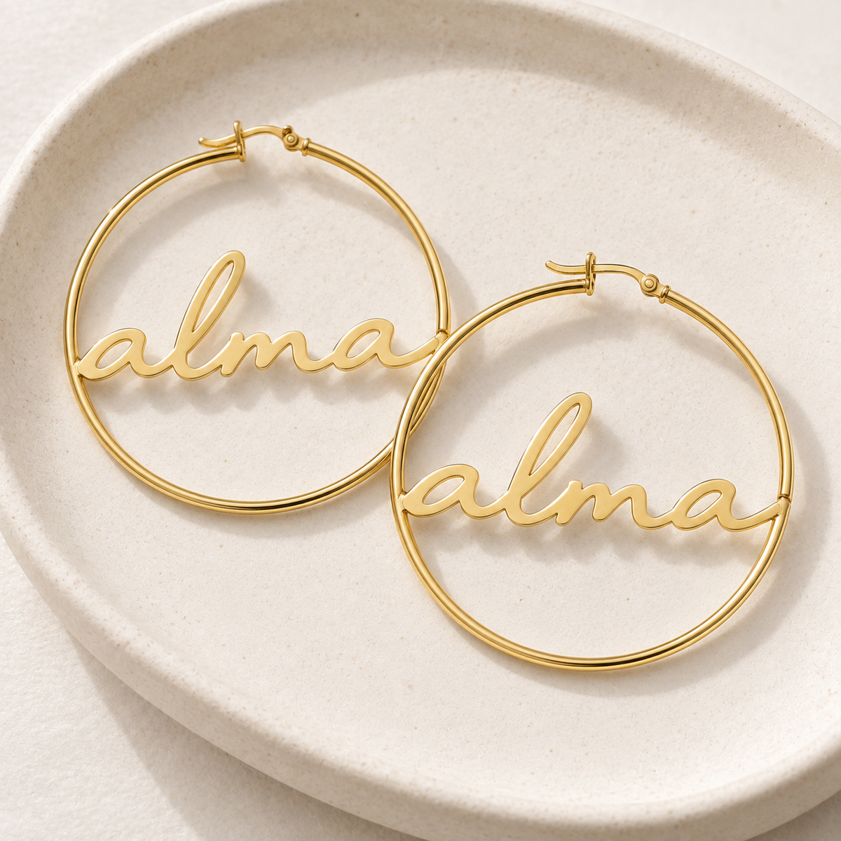 Custom Script Name Hoop Earrings glamour photo - gold script name hoops worn as a pair Anthology Jewelry