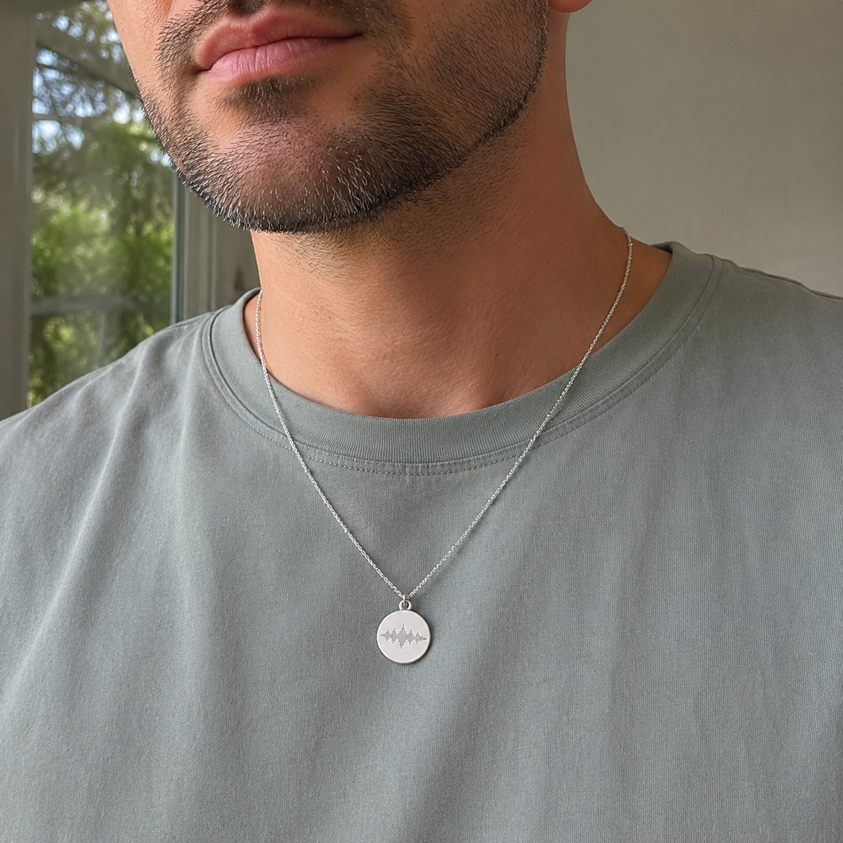 Custom Soundwave Necklace silver oval pendant lifestyle flat lay - Anthology Jewelry