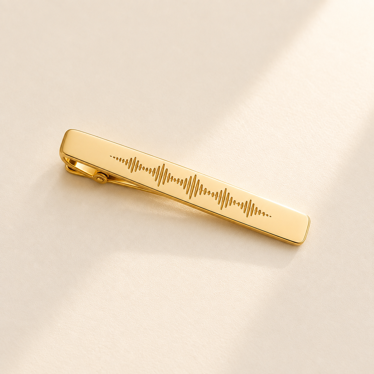 Custom Soundwave Tie Clip hero photo - gold tie clip with soundwave engraving Anthology Jewelry