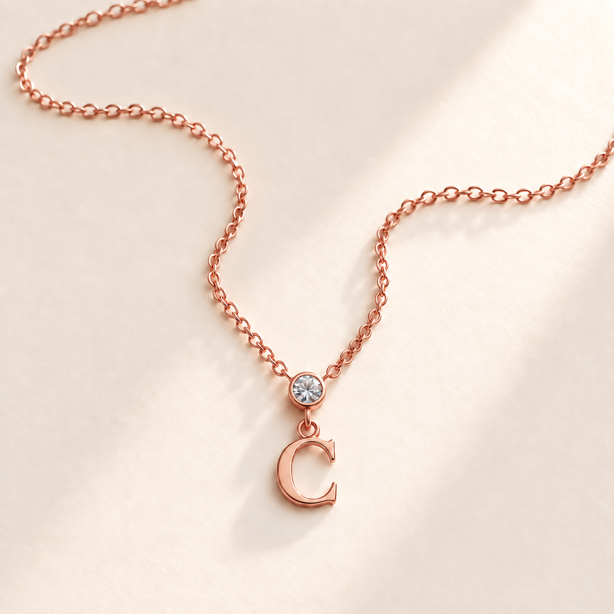 Custom Vertical Birthstone Initial Necklace april rose gold birthstone photo - round inline stone with hanging serif C Anthology Jewelry