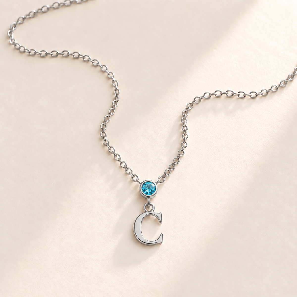 Custom Vertical Birthstone Initial Necklace december silver birthstone photo - round inline stone with hanging serif C Anthology Jewelry