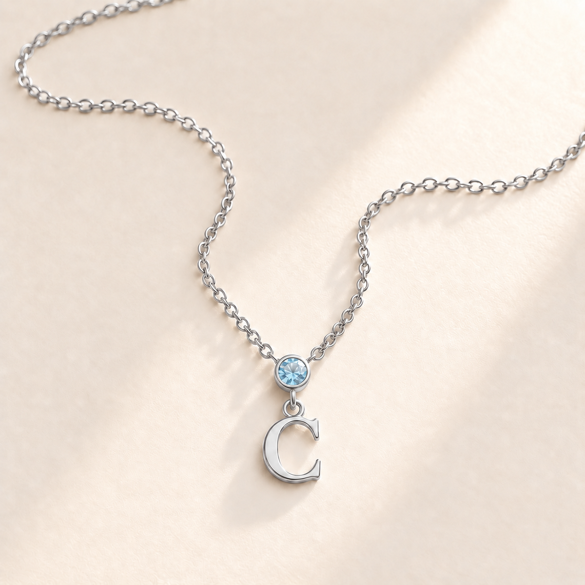 Custom Vertical Birthstone Initial Necklace march silver birthstone photo - round inline stone with hanging serif C Anthology Jewelry