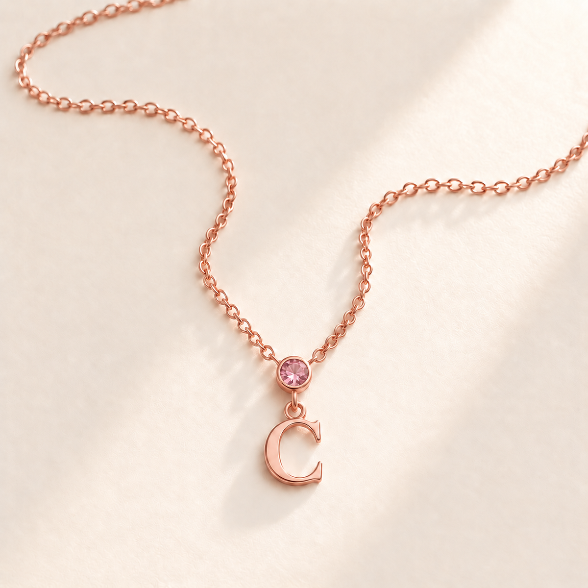 Custom Vertical Birthstone Initial Necklace october rose gold birthstone photo - round inline stone with hanging serif C Anthology Jewelry