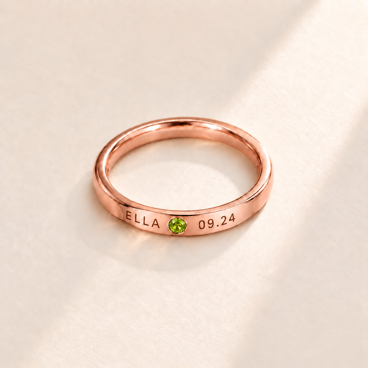 Custom Date & Name Birthstone Stacking Ring, August Peridot, Rose Gold finish. Illustrative product rendering; natural gemstone colors may vary.