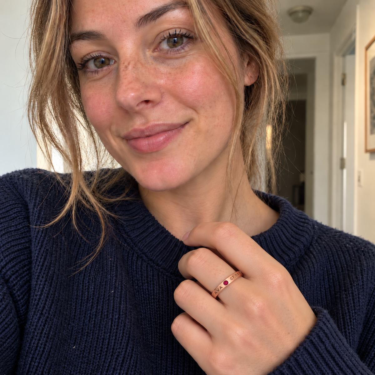 Custom Date & Name Birthstone Stacking Ring casual modeled photo - rose gold ring with AVA and 07.09 beside a red ruby Anthology Jewelry