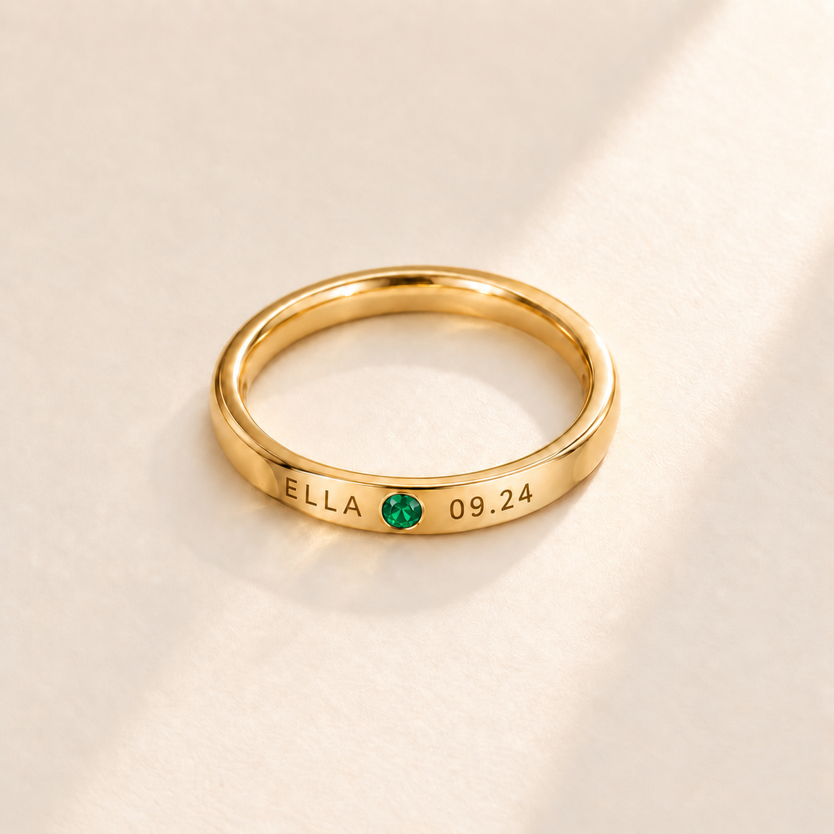 Custom Date & Name Birthstone Stacking Ring, May Emerald, Gold finish. Illustrative product rendering; natural gemstone colors may vary.