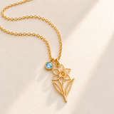 Custom Birth Flower & Birthstone Necklace hero photo - Gold December narcissus birth flower charm with Blue Topaz birthstone Anthology Jewelry