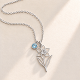 Custom Birth Flower & Birthstone Necklace hero photo - Silver December narcissus birth flower charm with Blue Topaz birthstone Anthology Jewelry
