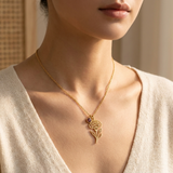 Custom Birth Flower & Birthstone Necklace lifestyle photo - woman wearing gold carnation birth flower charm with garnet birthstone drop Anthology Jewelry