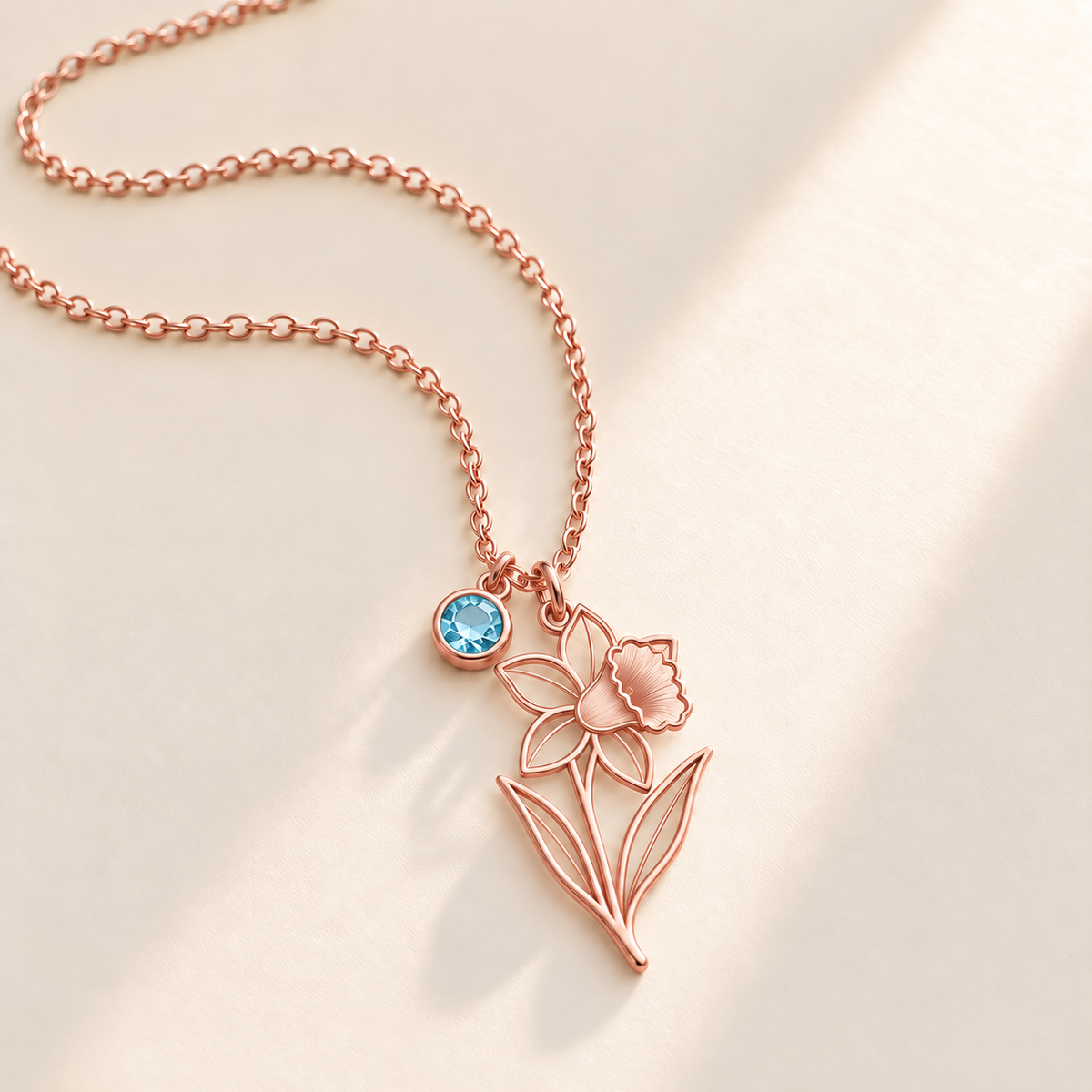 Custom Birth Flower & Birthstone Necklace hero photo - Rose Gold March daffodil birth flower charm with Aquamarine birthstone Anthology Jewelry